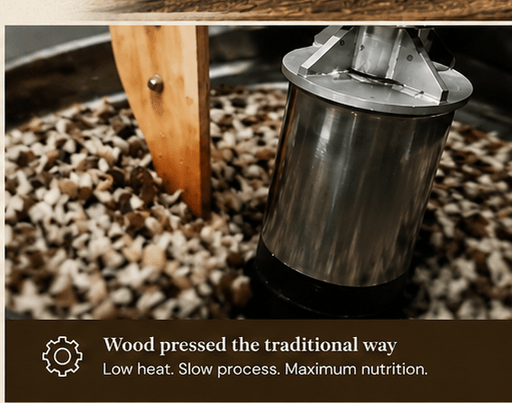 Traditional wood press action during the oil extraction process